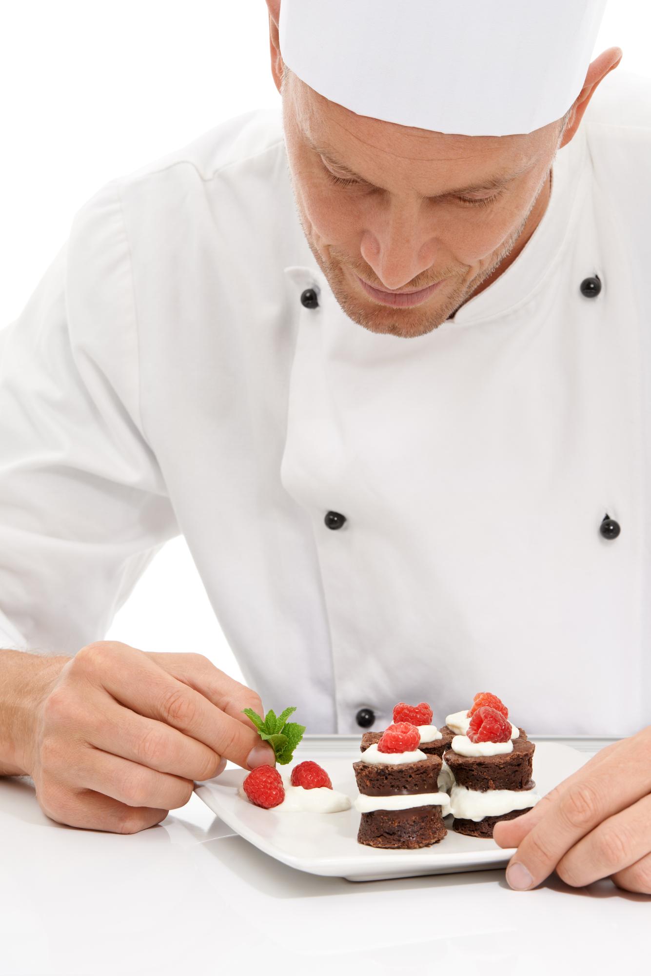 Pastry chef with plated desserts